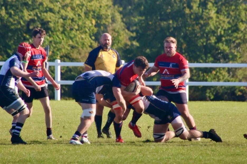 Travis Coetzer running through contact tackle.
