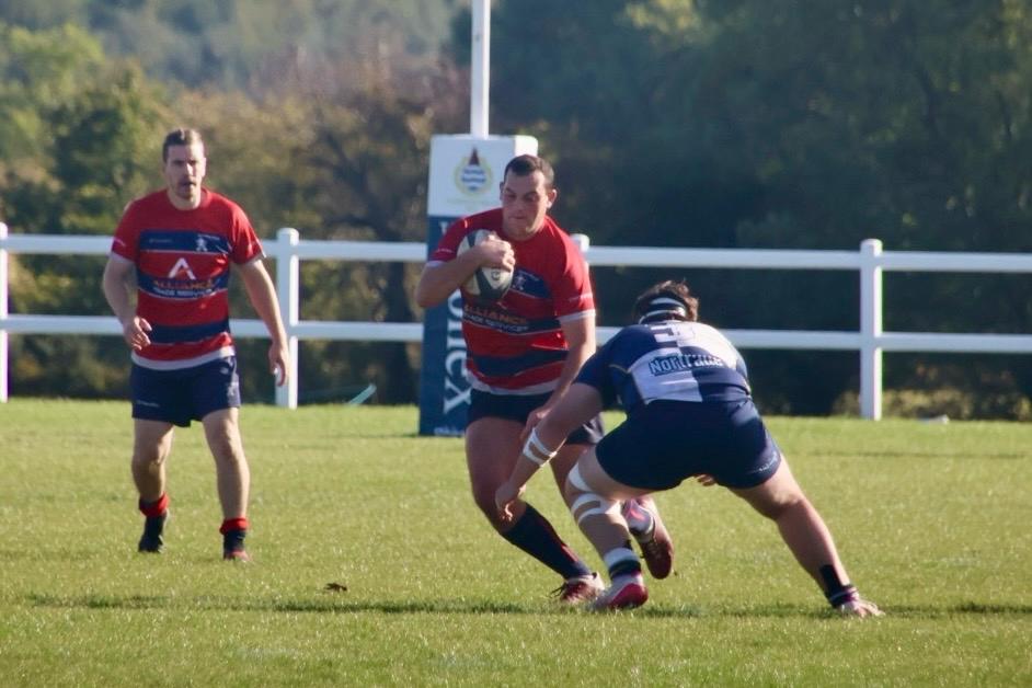 Phil Wilkins breaking through contact.