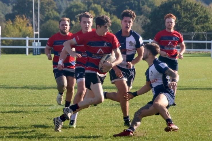 Sam Gale running with the ball into contact.