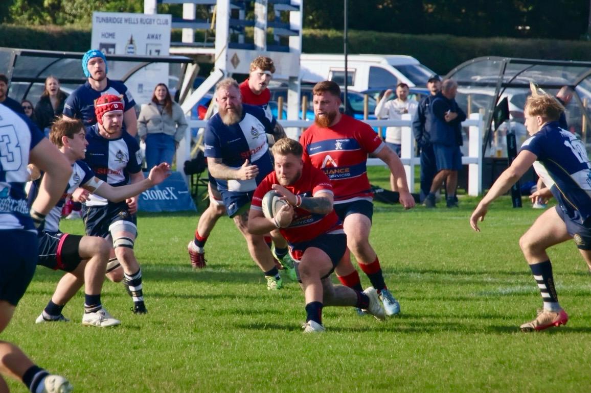Ben Pass running into contact with the ball.