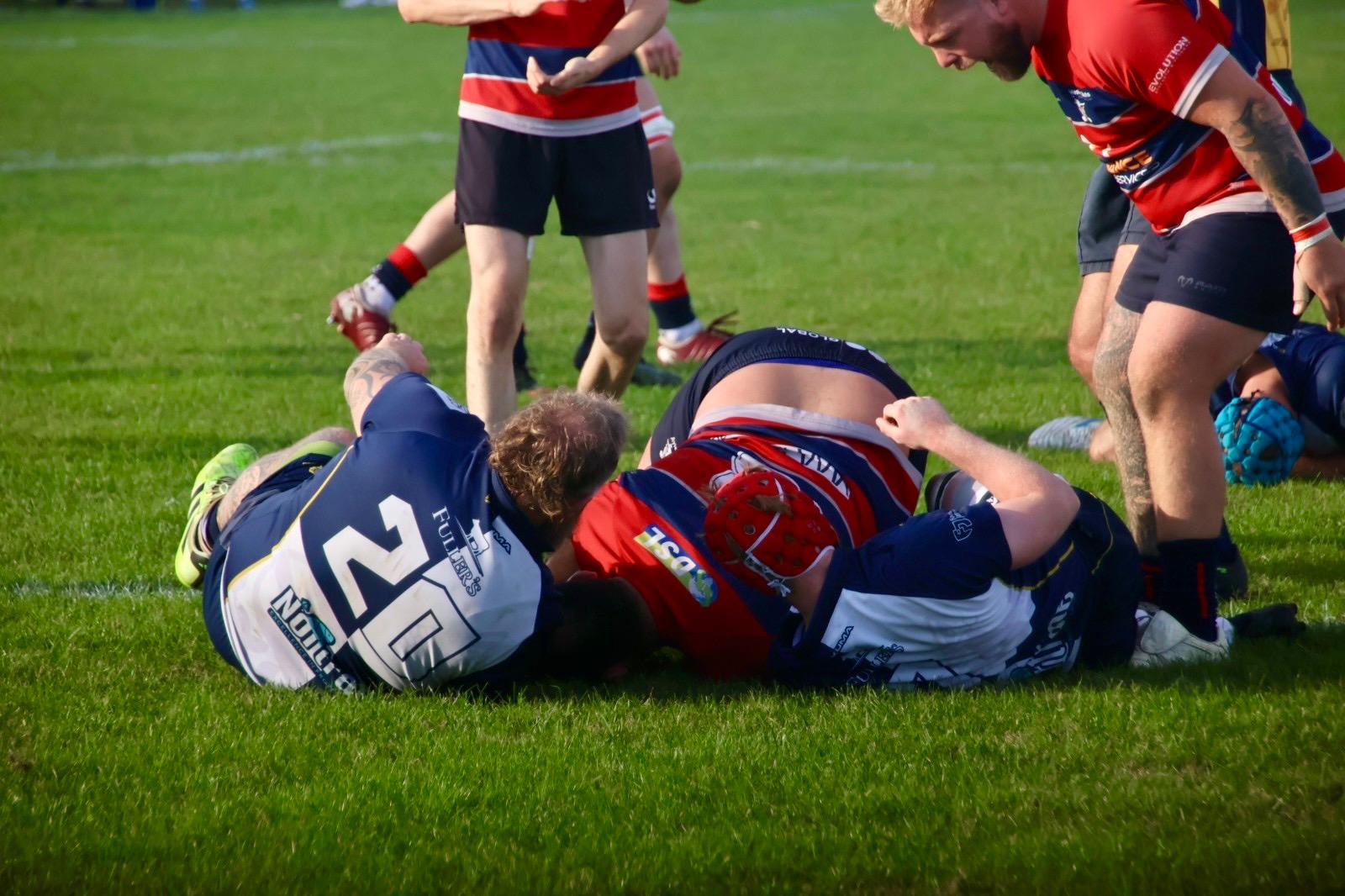 Phil Wilkins scores a try.